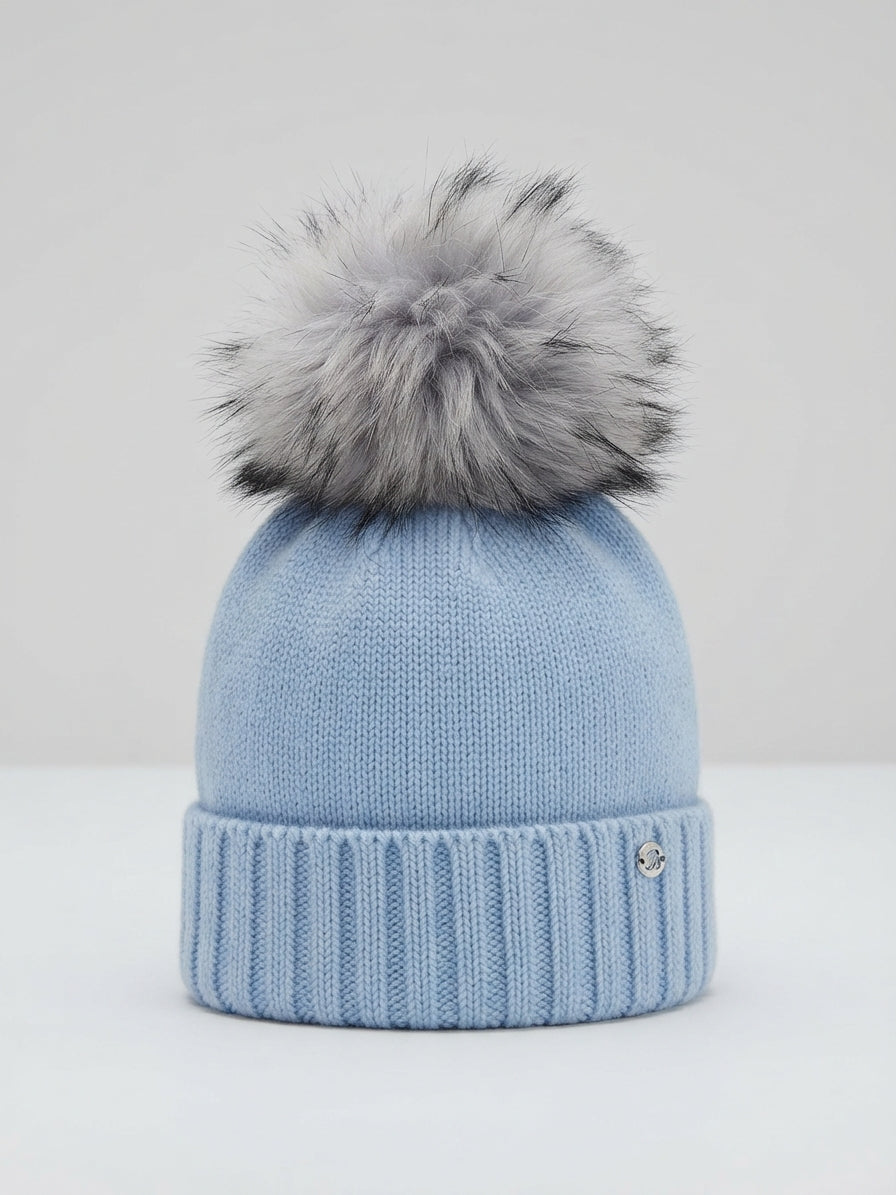 CAPPELLO CELESTE IN LANA CON POMPON M.